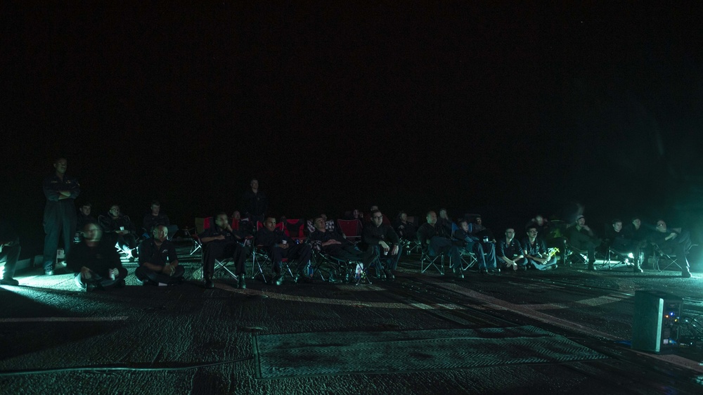 USS Normandy Watches Movie On Flight Deck