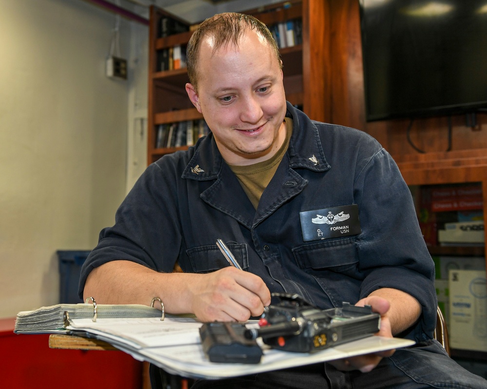 USS Normandy Sailor Inventories Radio