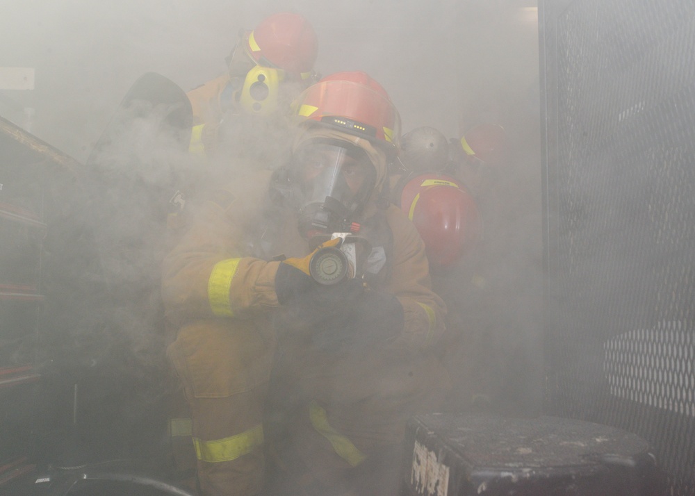 Sailors Practice Fire Fighting During General Quarters Drill