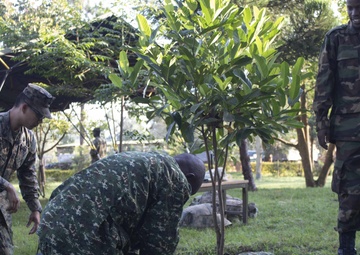 A U.S. Navy Sailor Advises Members of the Uganda People's Defence Force