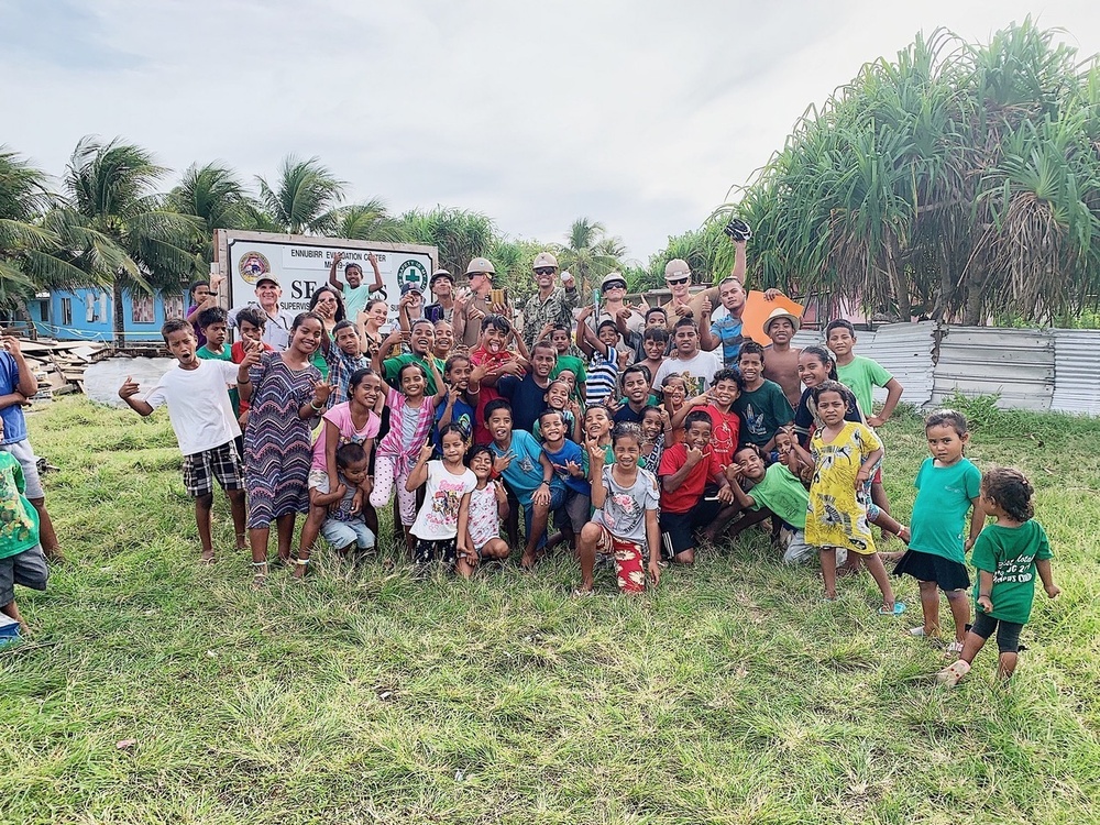 U.S. Navy Seabees with NMCB-5's Detail Marshall Islands donate toys to local children