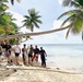 Seabees with NMCB-5's Detail Marshall Islands participate in an island clean-up