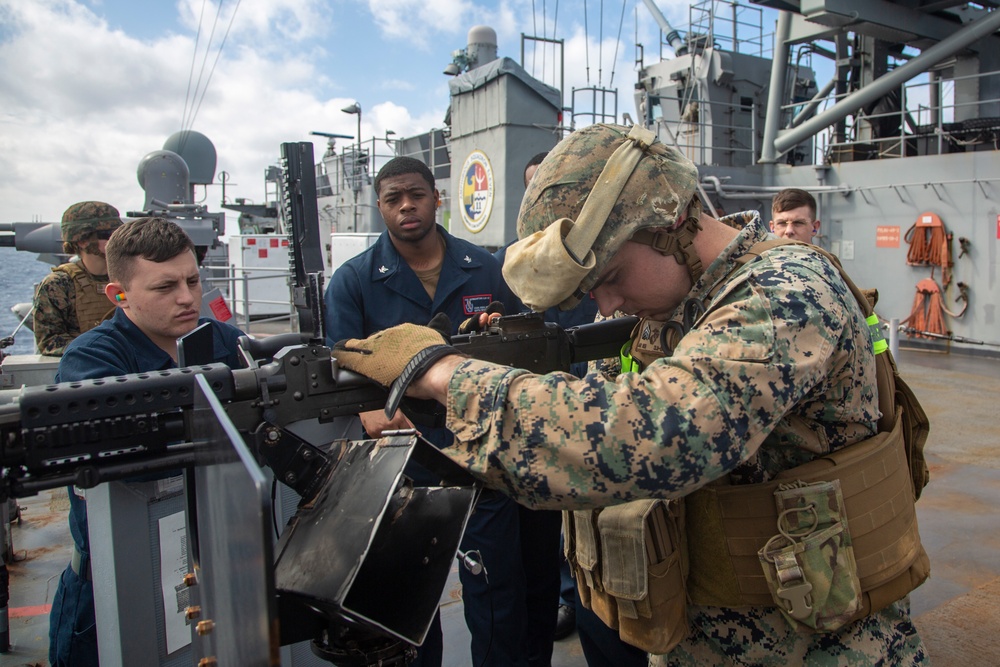 Blue-Green machine gun team: 31st MEU Marines train with Sailors on M240B