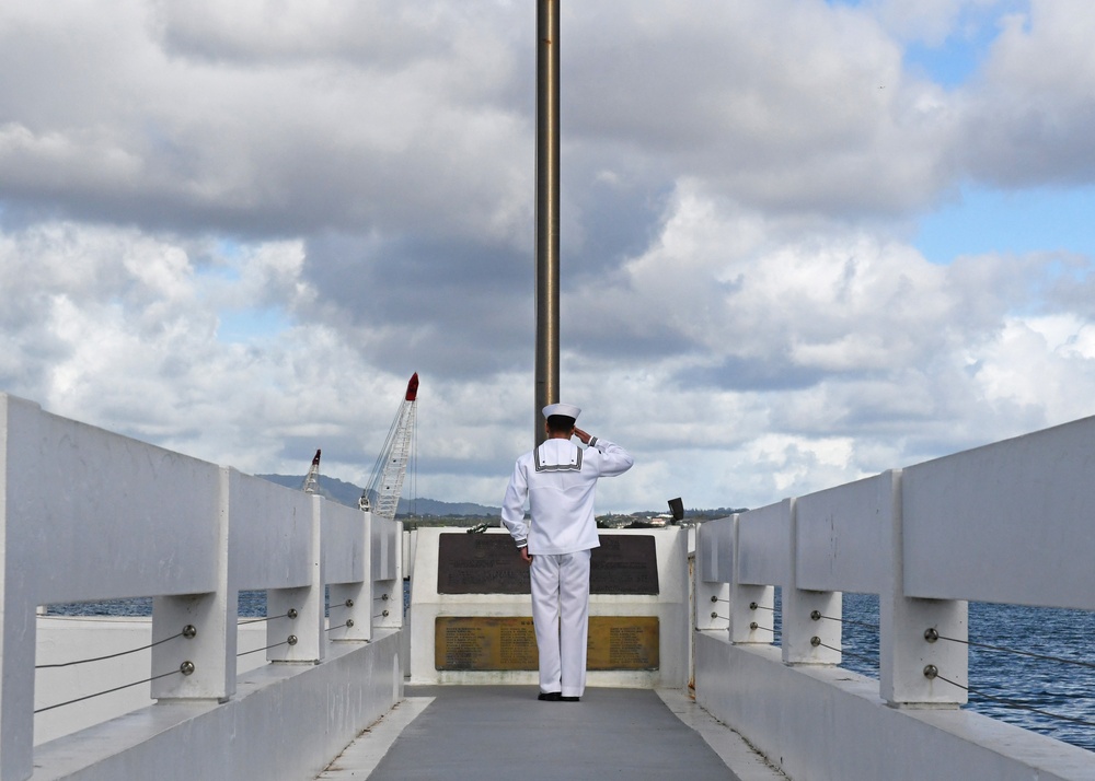 Navy Medical Readiness and Training Command Pearl Harbor Sailor Salutes Ensign at USS Utah Memorial