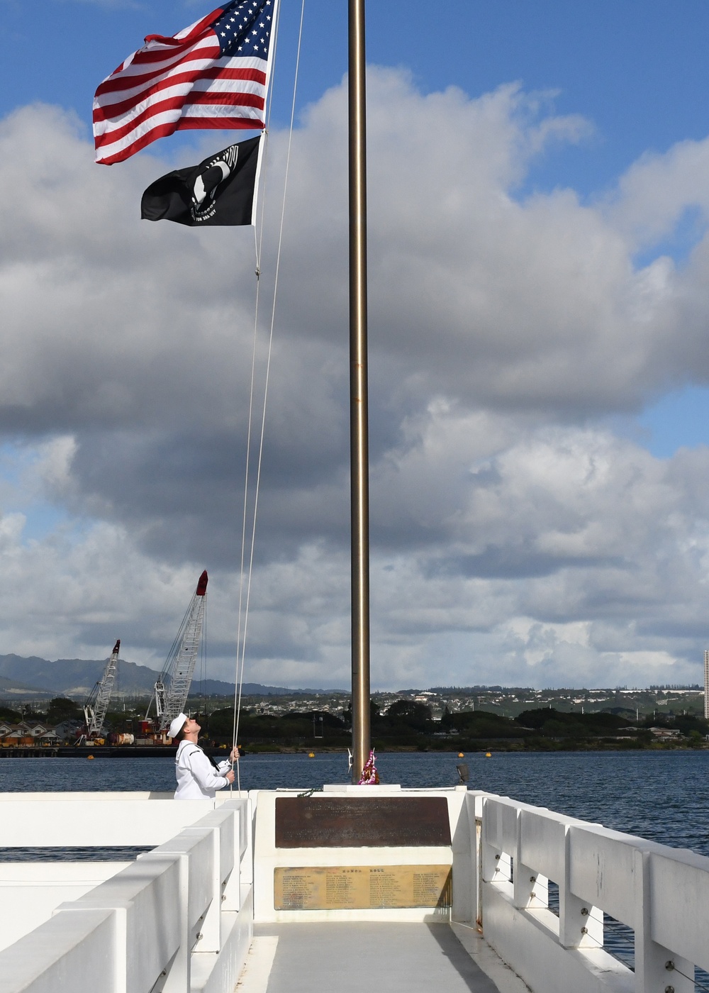 Navy Medical Readiness and Training Command Pearl Harbor Sailor Lowers the Ensign at the USS Utah Memorial