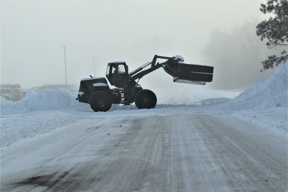 Fort McCoy RTS-Maintenance Soldier moves snow