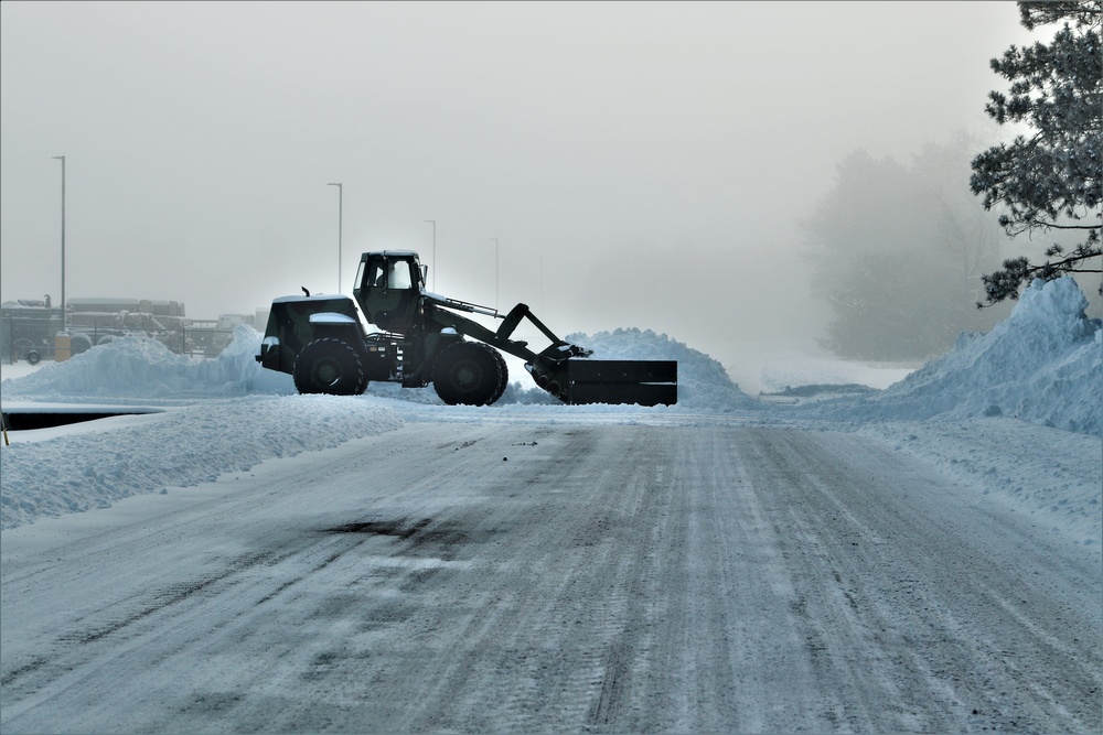 Fort McCoy RTS-Maintenance Soldier moves snow