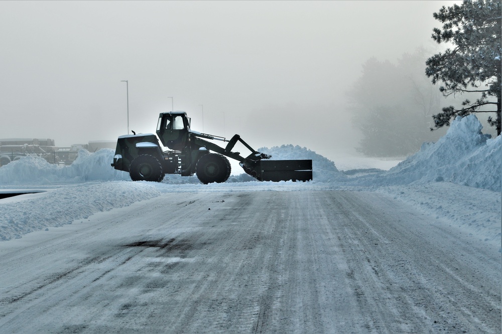 Fort McCoy RTS-Maintenance Soldier moves snow