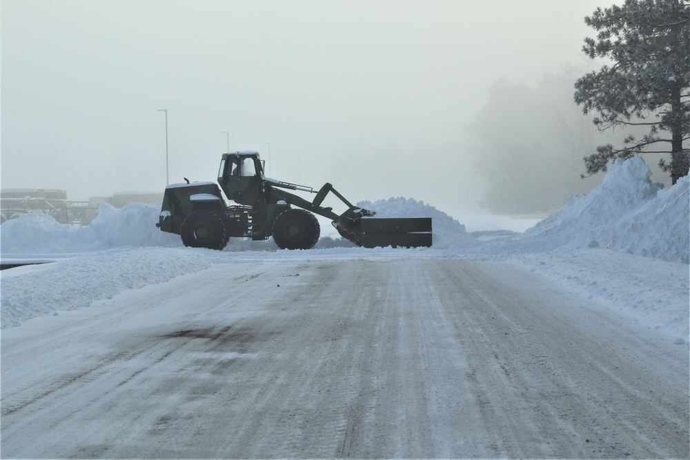 Fort McCoy RTS-Maintenance Soldier moves snow