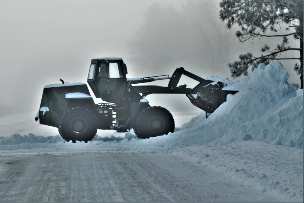Fort McCoy RTS-Maintenance Soldier moves snow
