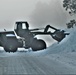 Fort McCoy RTS-Maintenance Soldier moves snow