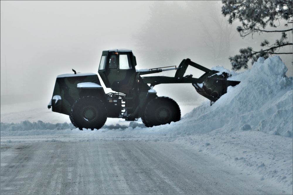 Fort McCoy RTS-Maintenance Soldier moves snow