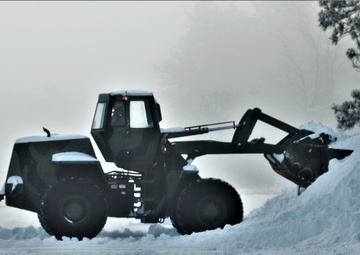 Fort McCoy RTS-Maintenance Soldier moves snow