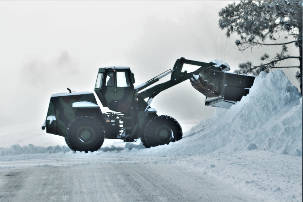 Fort McCoy RTS-Maintenance Soldier moves snow