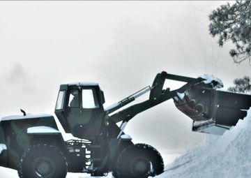 Fort McCoy RTS-Maintenance Soldier moves snow