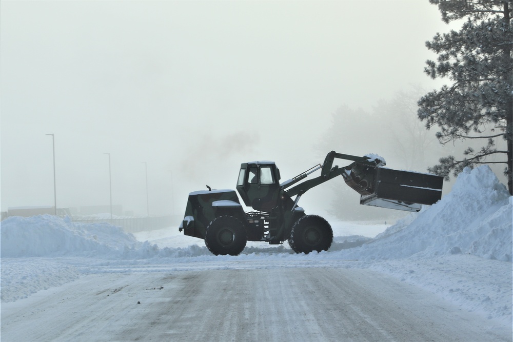Fort McCoy RTS-Maintenance Soldier moves snow
