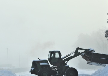 Fort McCoy RTS-Maintenance Soldier moves snow