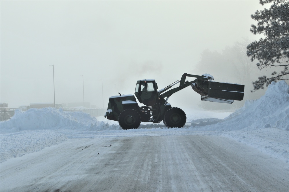 Fort McCoy RTS-Maintenance Soldier moves snow