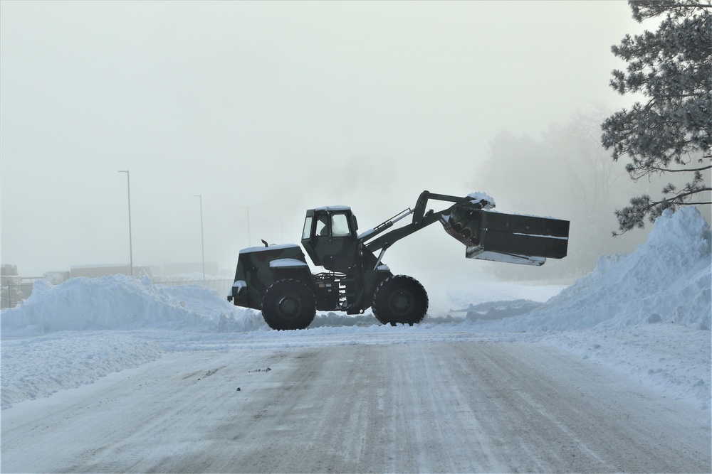 Fort McCoy RTS-Maintenance Soldier moves snow