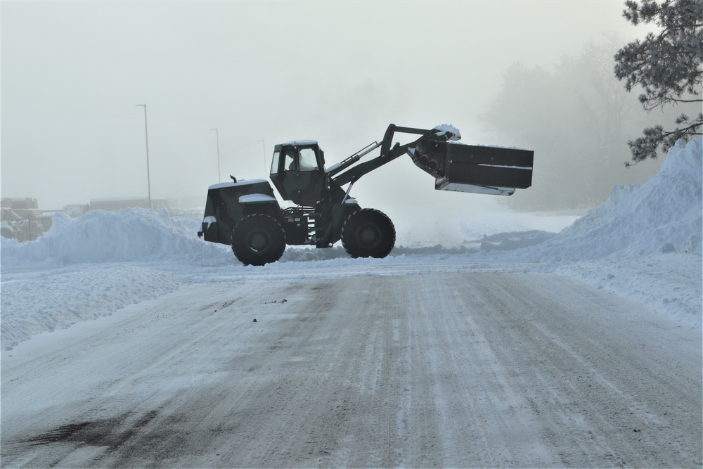 Fort McCoy RTS-Maintenance Soldier moves snow