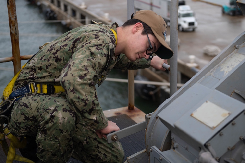 U.S. Sailor conducts maintenance on the flight deck