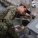 U.S. Sailor conducts maintenance on the flight deck