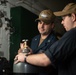 U.S. Sailors refill a nitrogen bottle