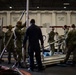 U.S. Sailors unload a weapons elevator