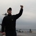 U.S. Sailor directs crane