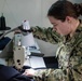 U.S Sailor stitches uniform