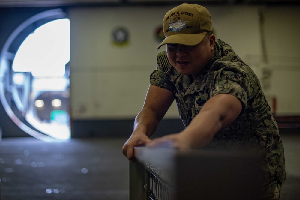 U.S Sailor moves bed grate