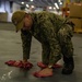 U.S Sailor cleans oil