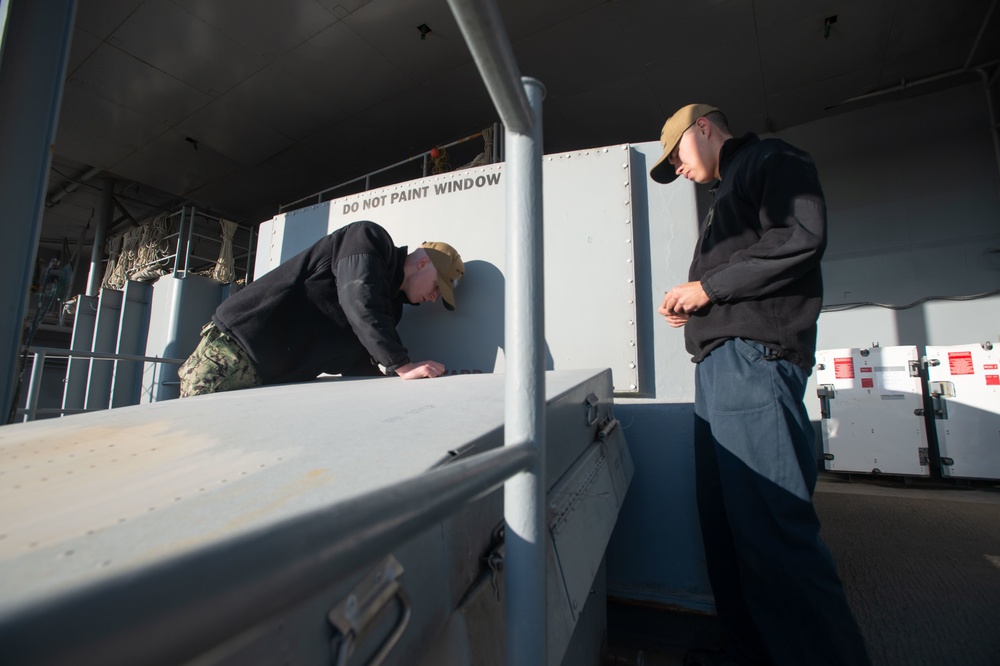 Sailors conduct corrosion control