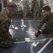 31st MEU Marines conduct a mission brief aboard USS America