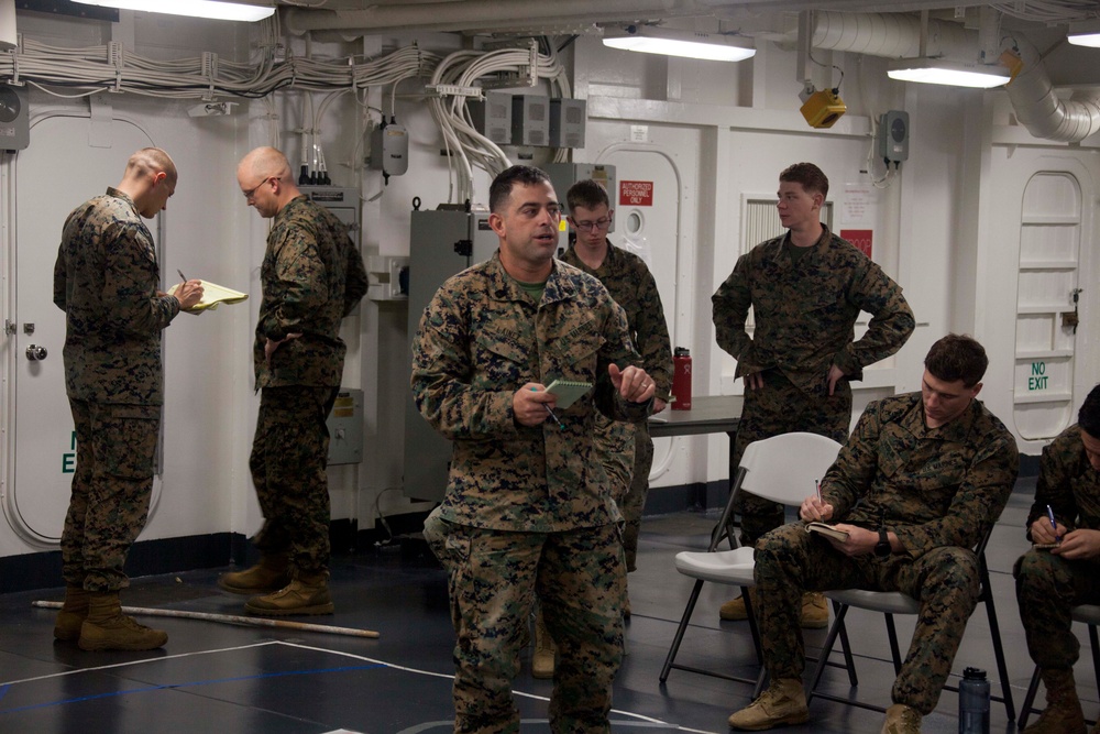 31st MEU Marines conduct a mission brief aboard USS America