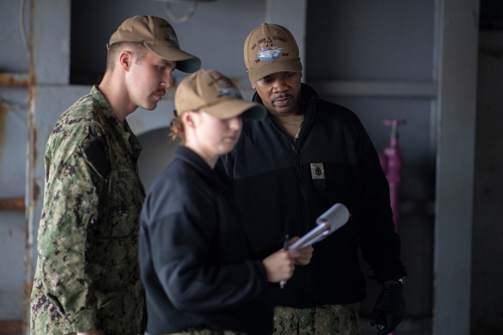 U.S. Sailors conduct a zone inspection.