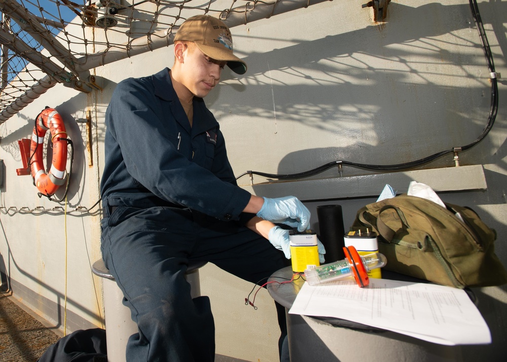 U.S. Sailor perfoms maintenance
