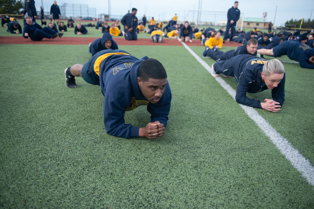 U.S. Sailors hold a plank during command physical training for the aircraft carrier USS John C. Stennis (CVN 74) in Norfolk, Virginia, Jan. 31, 2020.