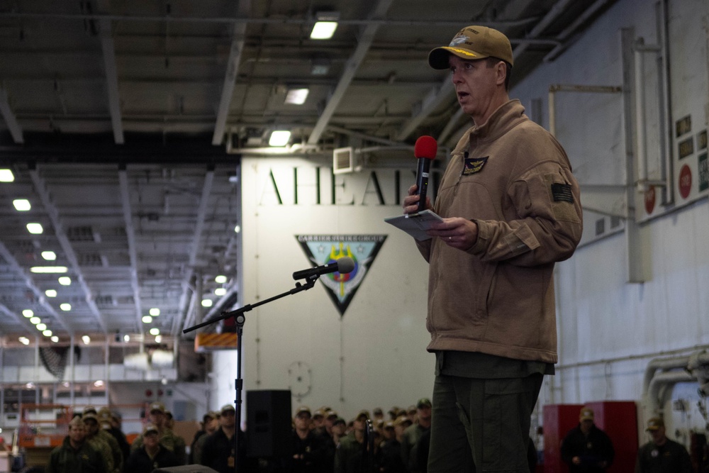U.S. Navy Capt. J. Patrick Thompson, executive officer of the aircraft carrier USS John C. Stennis (CVN 74), speaks at an all-hands call