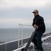 U.S. Sailor prepares for maintenance on the flight deck