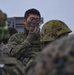 Japanese Soldier Applies Face Paint