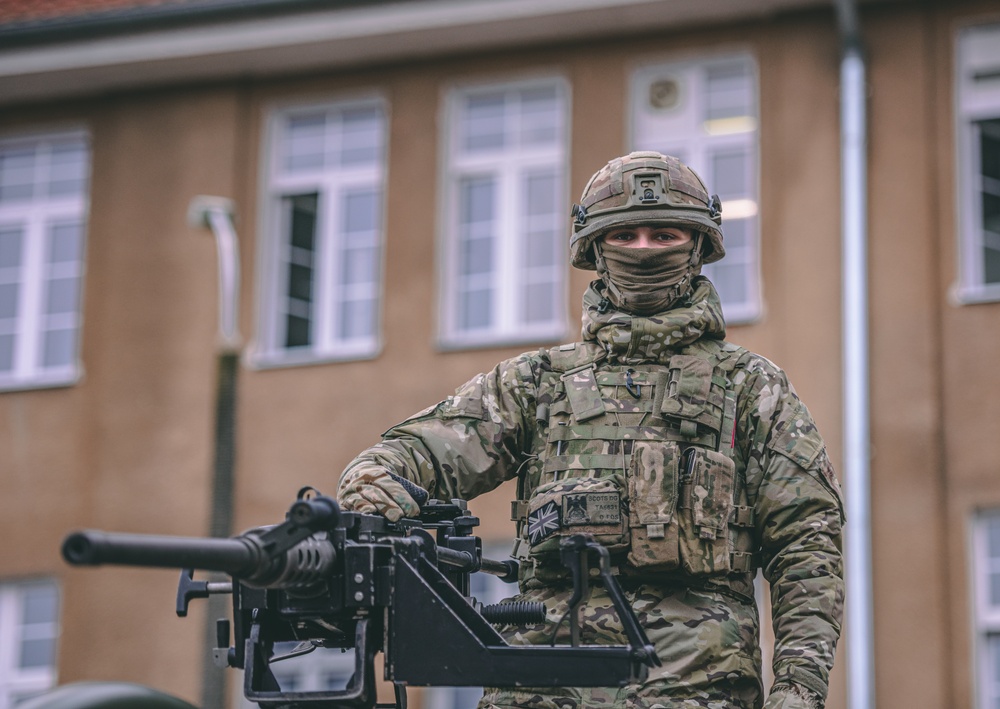 NATO Battle Group Poland Soldiers collaborate to put on a static display for local school children