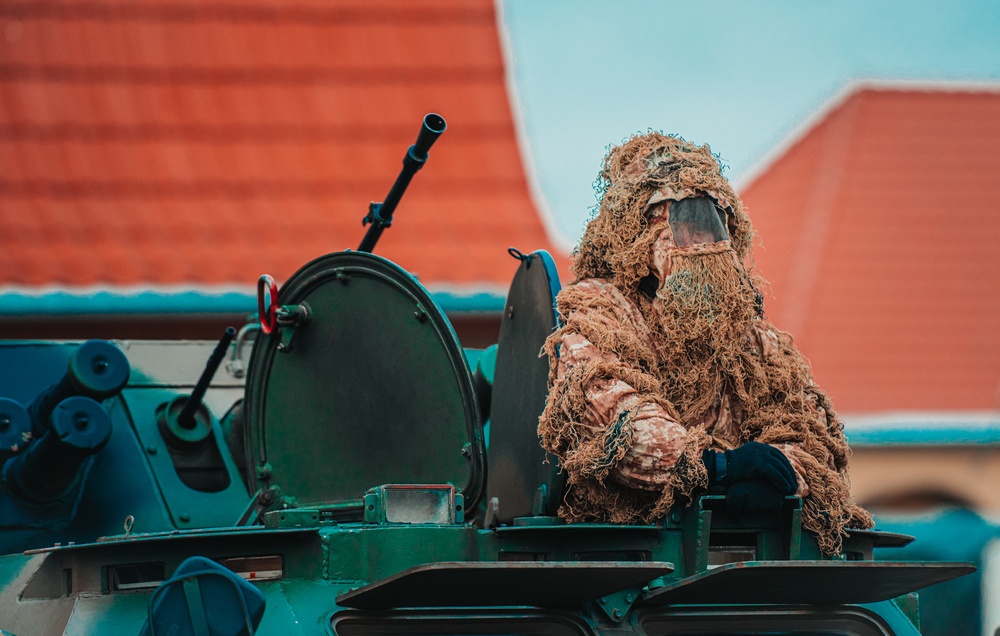 NATO Battle Group Poland Soldiers collaborate to put on a static display for local school children