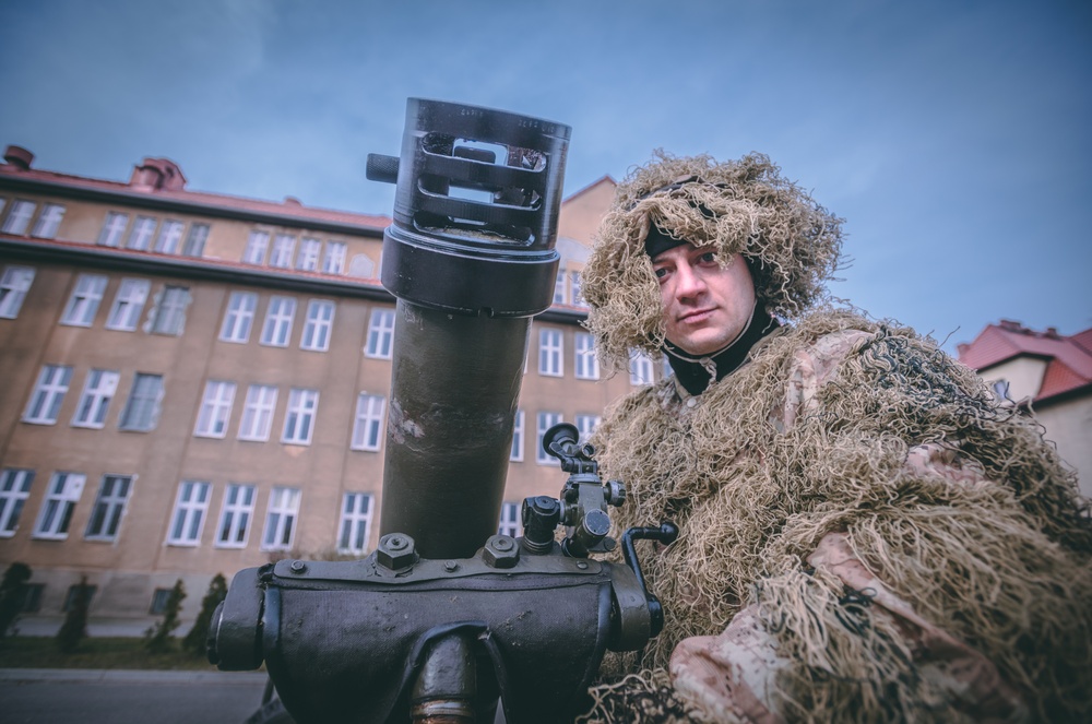 NATO Battle Group Poland Soldiers collaborate to put on a static display for local school children