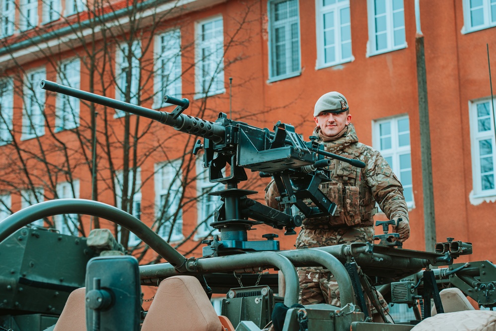 NATO Battle Group Poland Soldiers collaborate to put on a static display for local school children