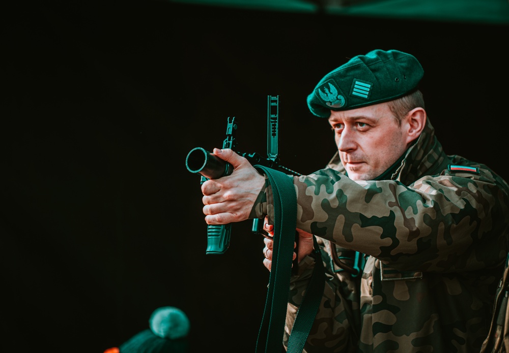 NATO Battle Group Poland Soldiers collaborate to put on a static display for local school children