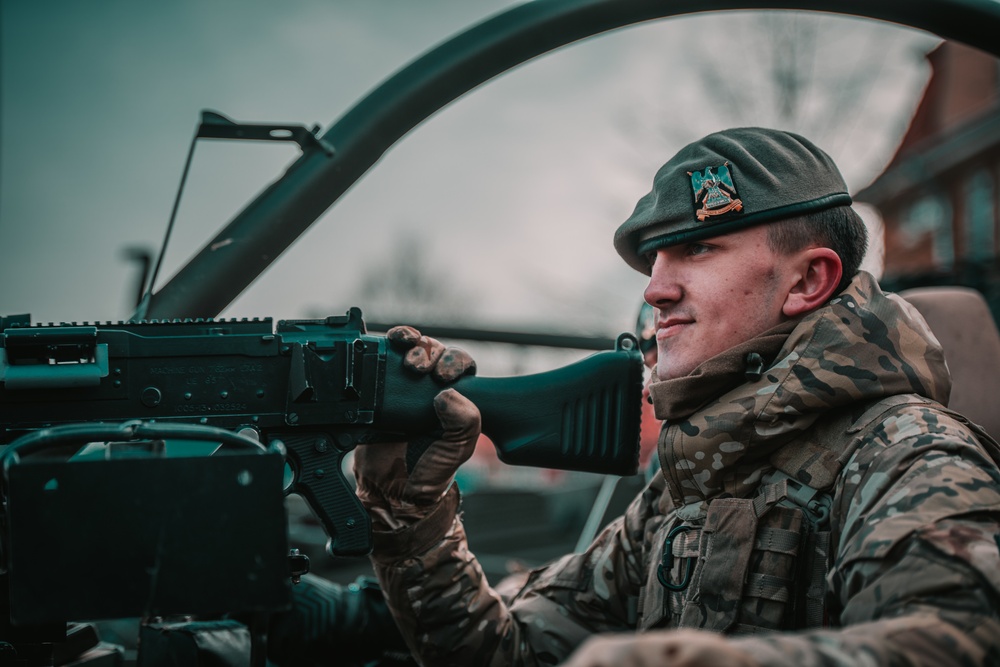 NATO Battle Group Poland Soldiers collaborate to put on a static display for local school children