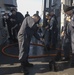 Sailors Participate in fresh water wash down
