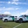 CBP Support to Super Bowl LIV Two U.S. Customs and Border Protection (CBP) Border Patrol vehicles are parked on a grass field outside Hard Rock Stadium in Miami, Florida, during Super Bowl LIV. The vehicles — a Chevrolet Tahoe SUV and a Ford F-150 Raptor marked 'Mobile Command' — display the agency's distinctive white and green livery. This appears to be a security deployment for the Super Bowl LIV event, visible on the stadium signage in the background.