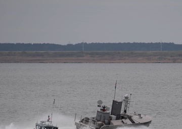 A developmental, early variant of the Common Unmanned Surface Vehicle (CUSV) autonomously conducts maneuvers